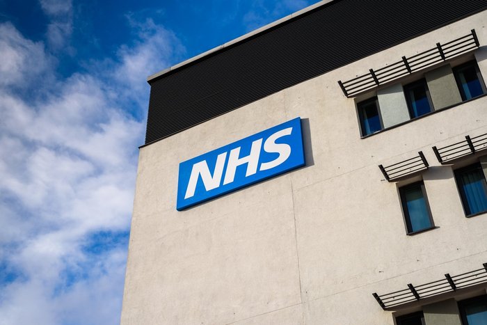 NHS logo on the side of a building