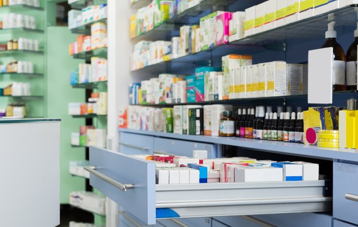 Pharmacy with shelves full of medicine.