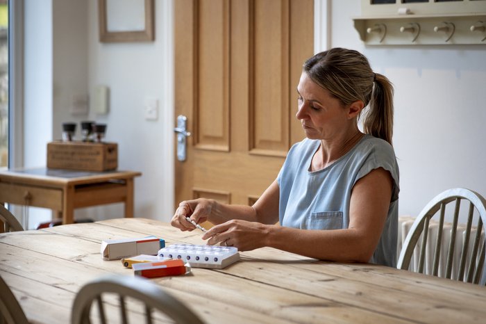 Woman organising medication